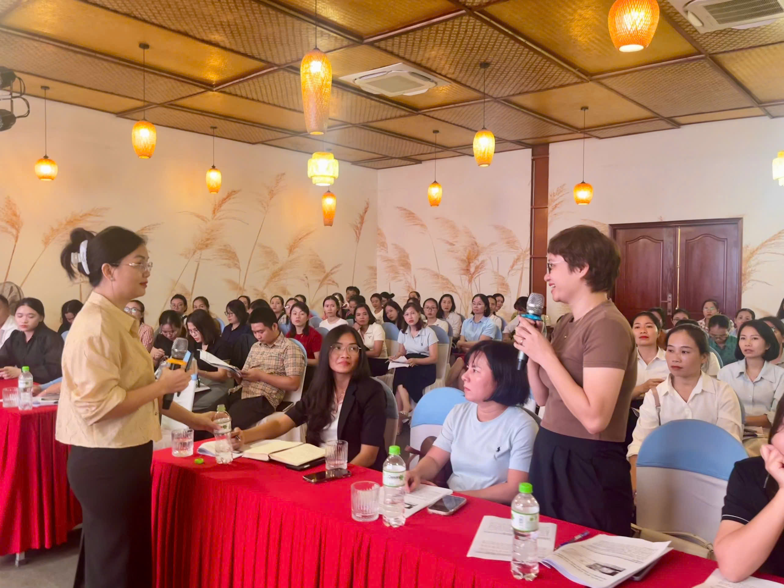 A person speaking to a group of peopleDescription automatically generated