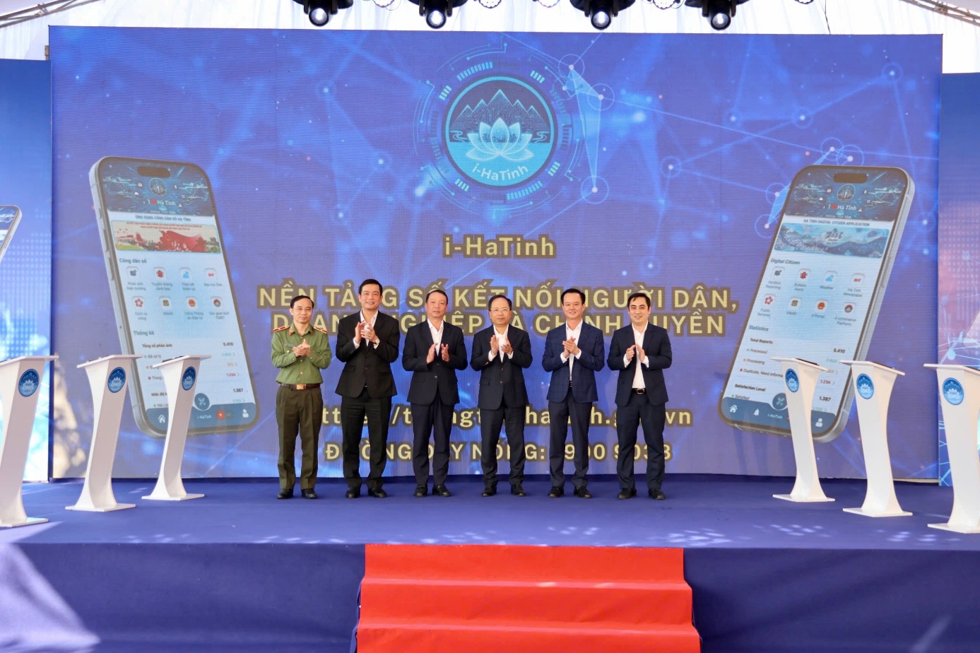 A group of men standing on a stageDescription automatically generated